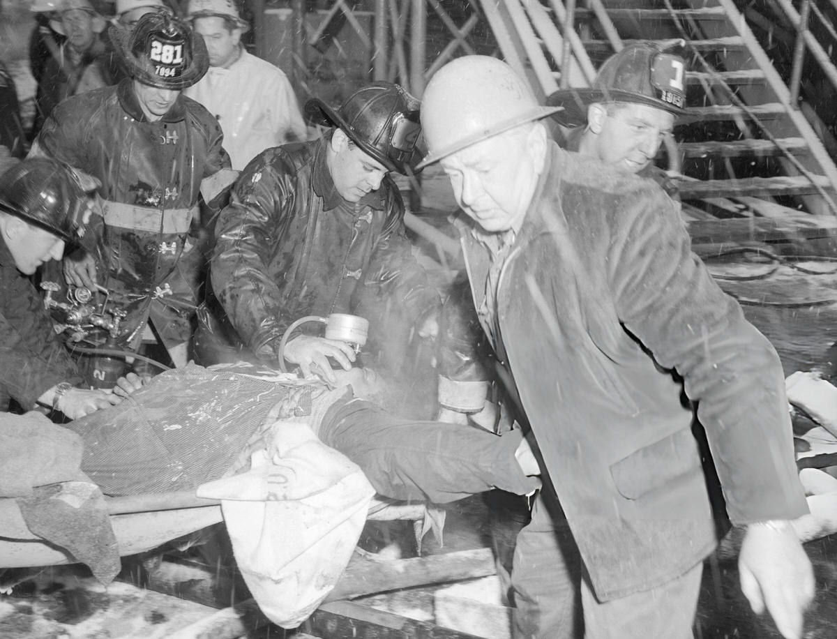 Firefighters Carrying A Victim Of The Uss Constellation Fire At The Brooklyn Navy Yard, 1960.