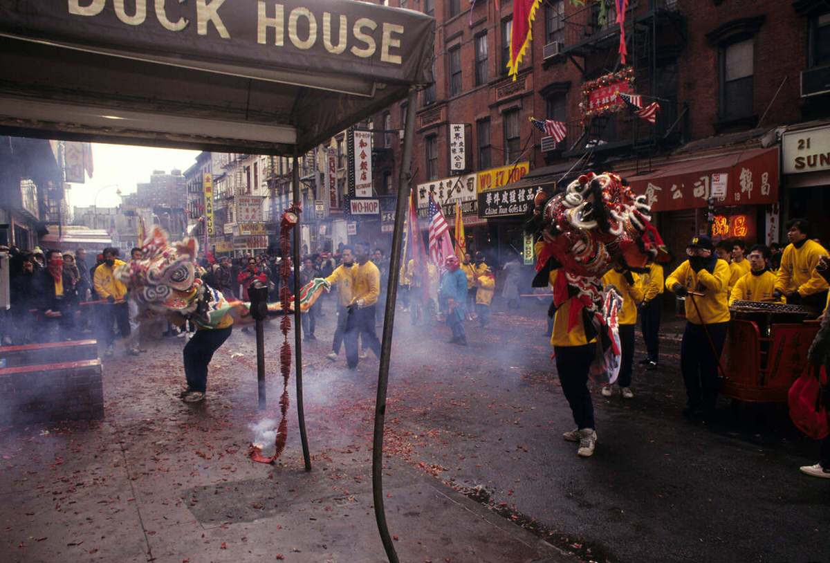 Lion Dancers And Firecrackers During The Annual Chinese New Year Procession, Chinatown, 1991.