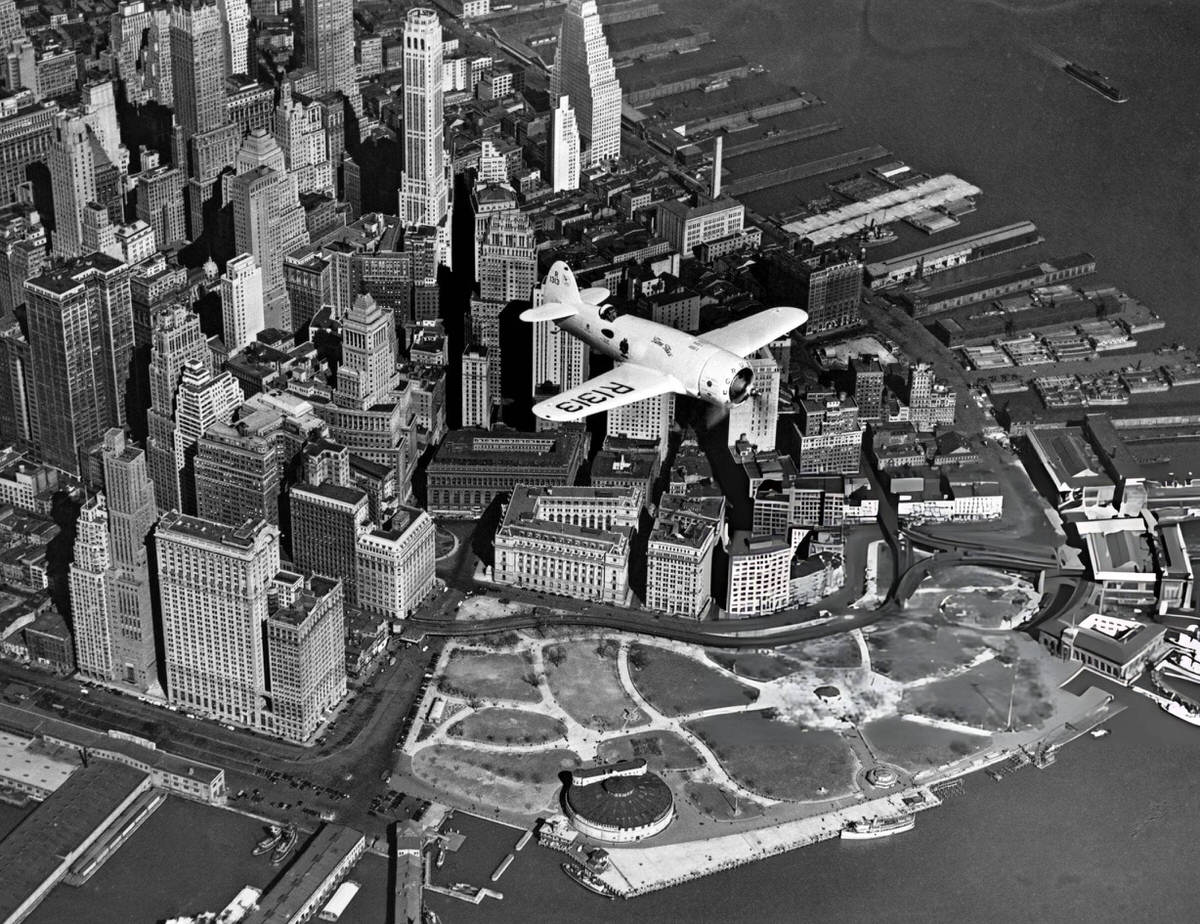 Captain Frank Hawks Flying A Speed Plane Over Battery Park And The Financial District, 1937.
