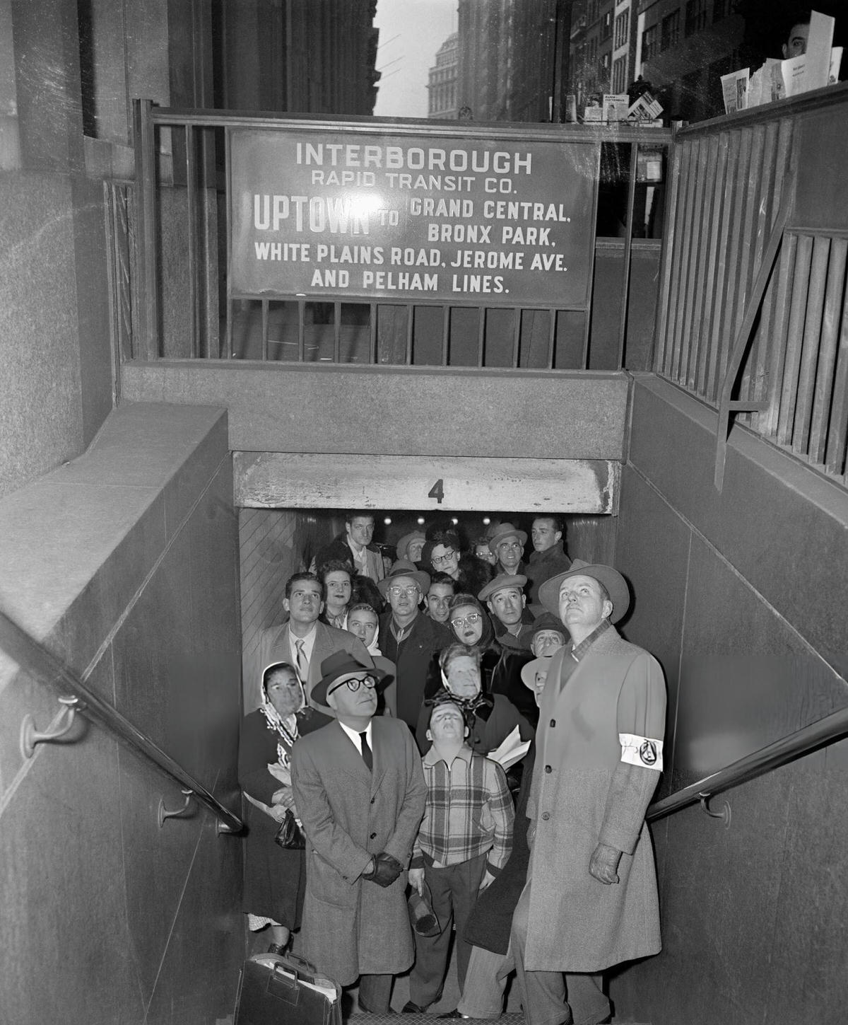 People Looking Up From A Subway Entrance At Wall Street And Broadway During An Air Raid Drill, 1951.