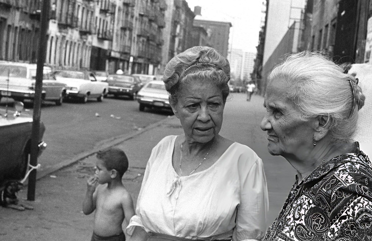 Two Elderly Women Talking On A Sidewalk During The Young Lords Party'S Garbage Offensive In El Barrio, East Harlem, 1969.