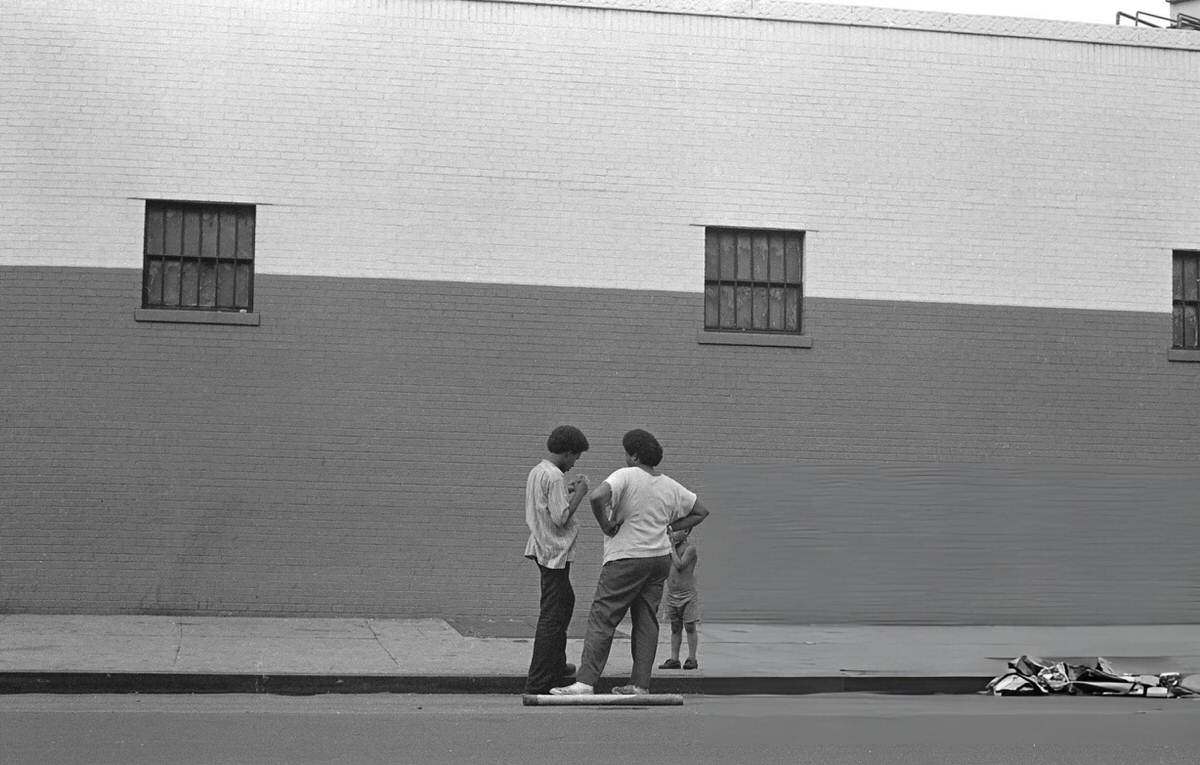 Two Young Men And A Boy Talking On A Sidewalk During The Young Lords Party'S Garbage Offensive In El Barrio, East Harlem, 1969.