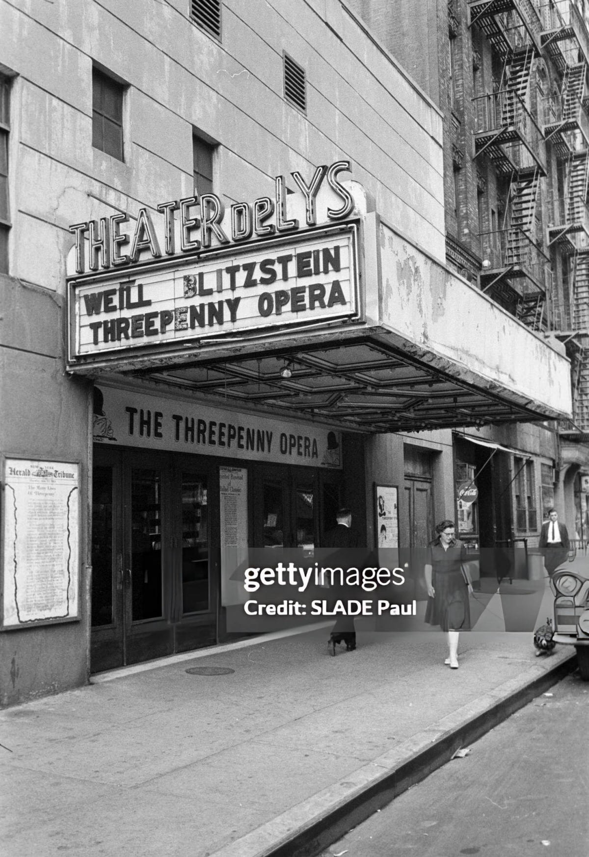 Pedestrians In Front Of The Theatre De Lys During A Production Of The Threepenny Opera, Greenwich Village, 1961.