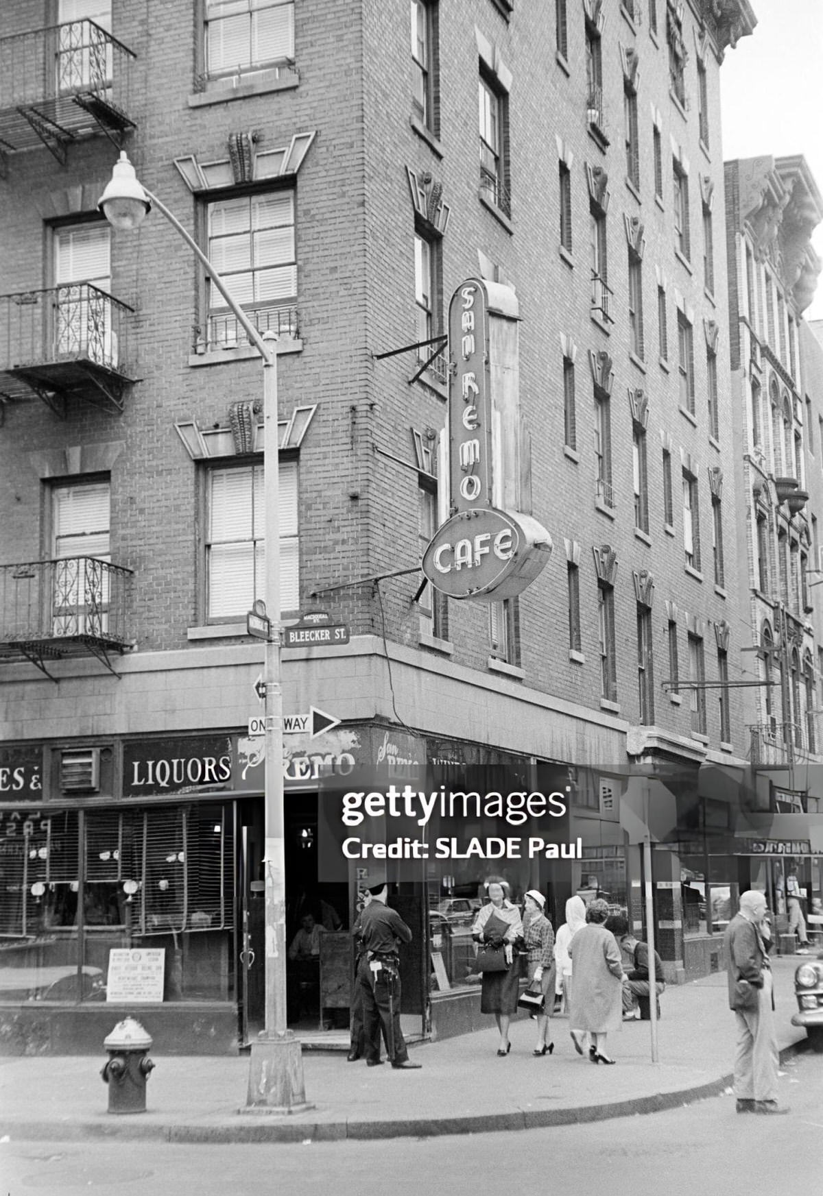 Pedestrians And Police Officers In Front Of The Cafe San Remo, Greenwich Village, 1961.