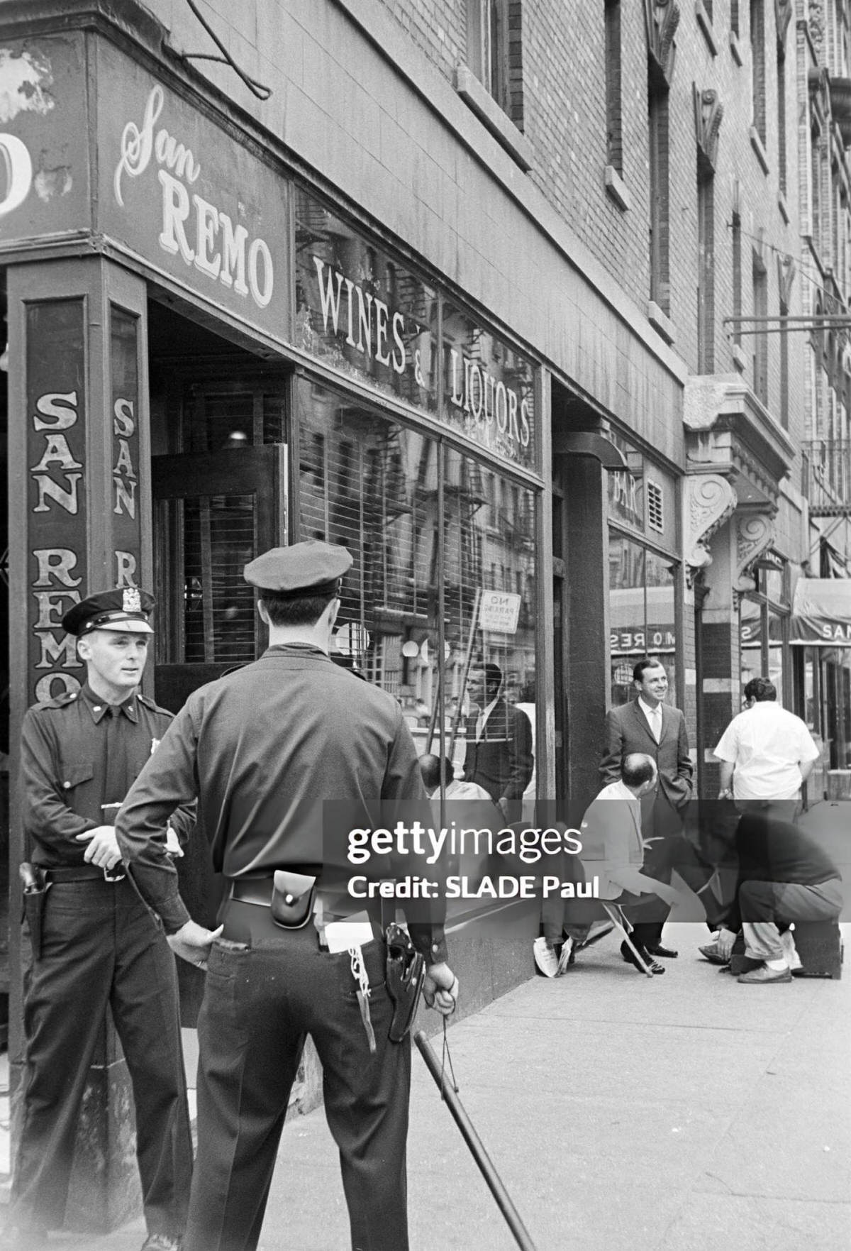 Police Officers Watching A Shoeshine Boy And Customers Outside Cafe San Remo, Greenwich Village, 1961.