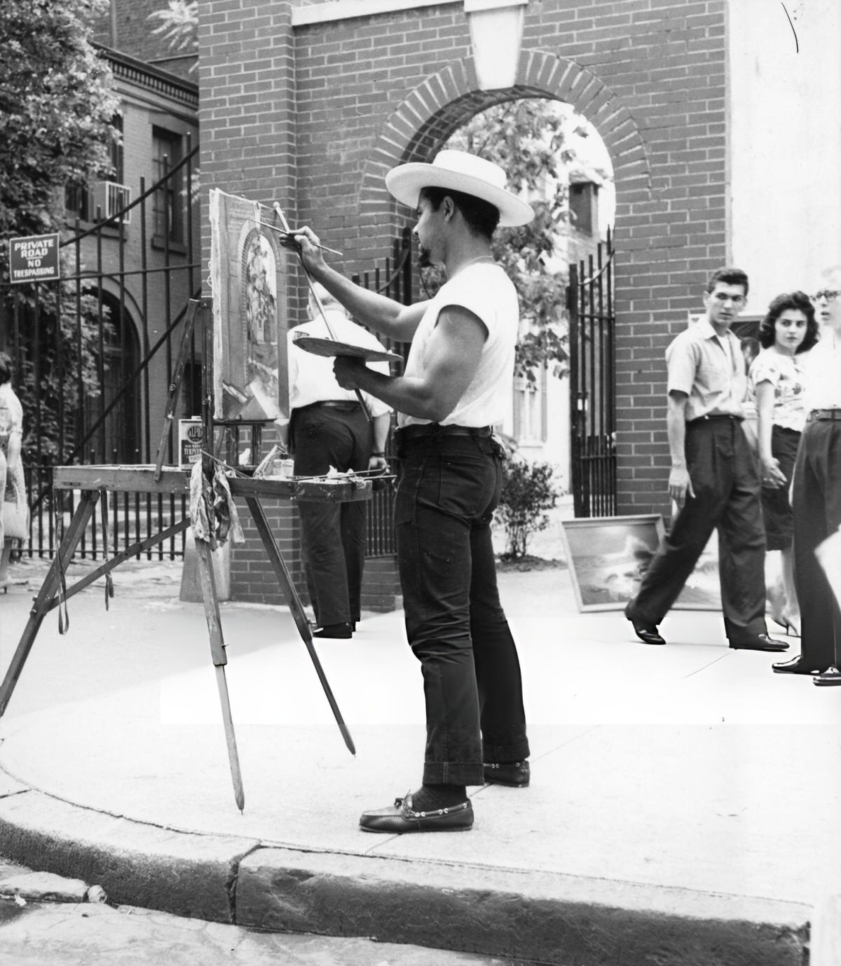 Artist Painting The Archway At Washington Mews, 1963.