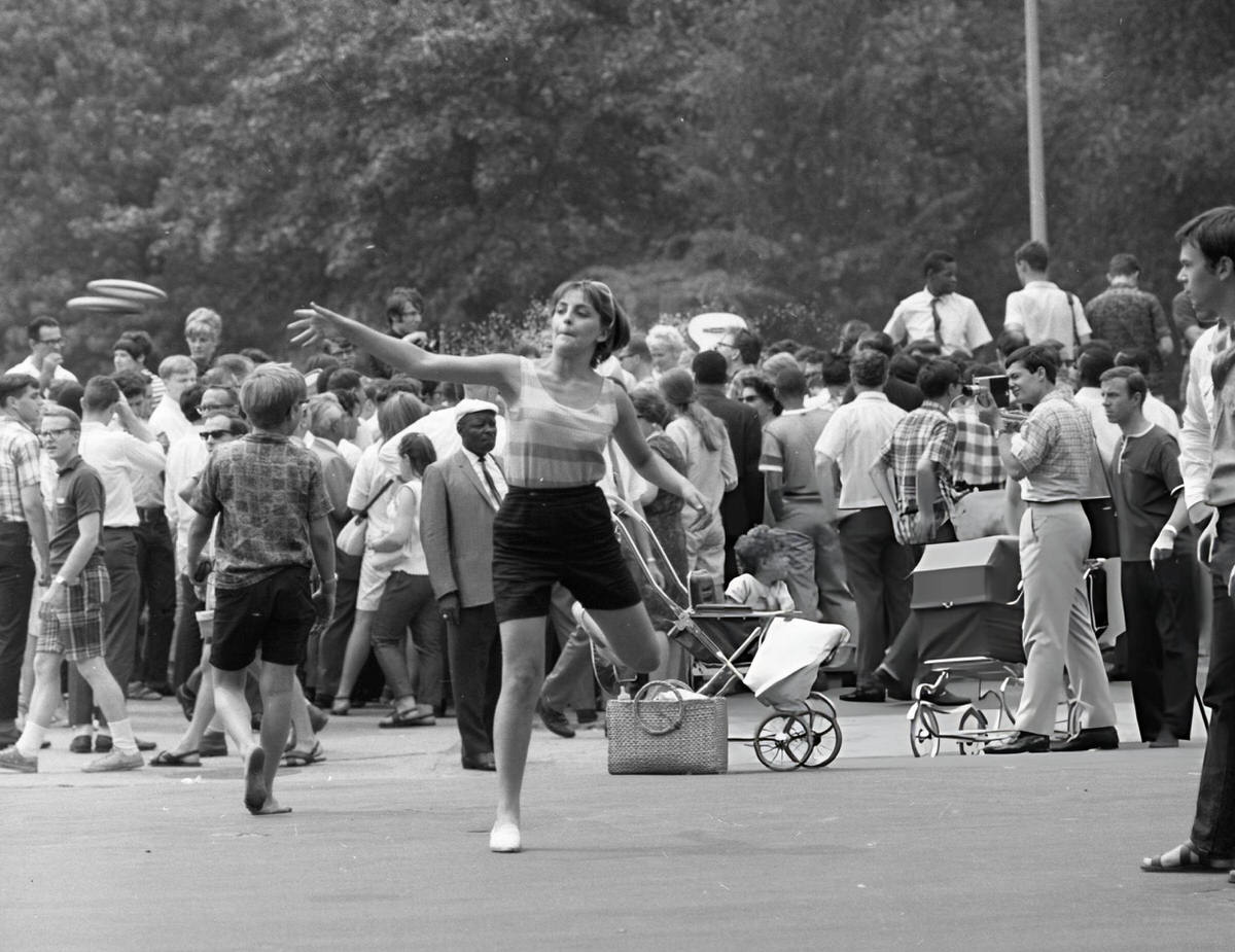 Person Playing With Frisbees In Washington Square Park.