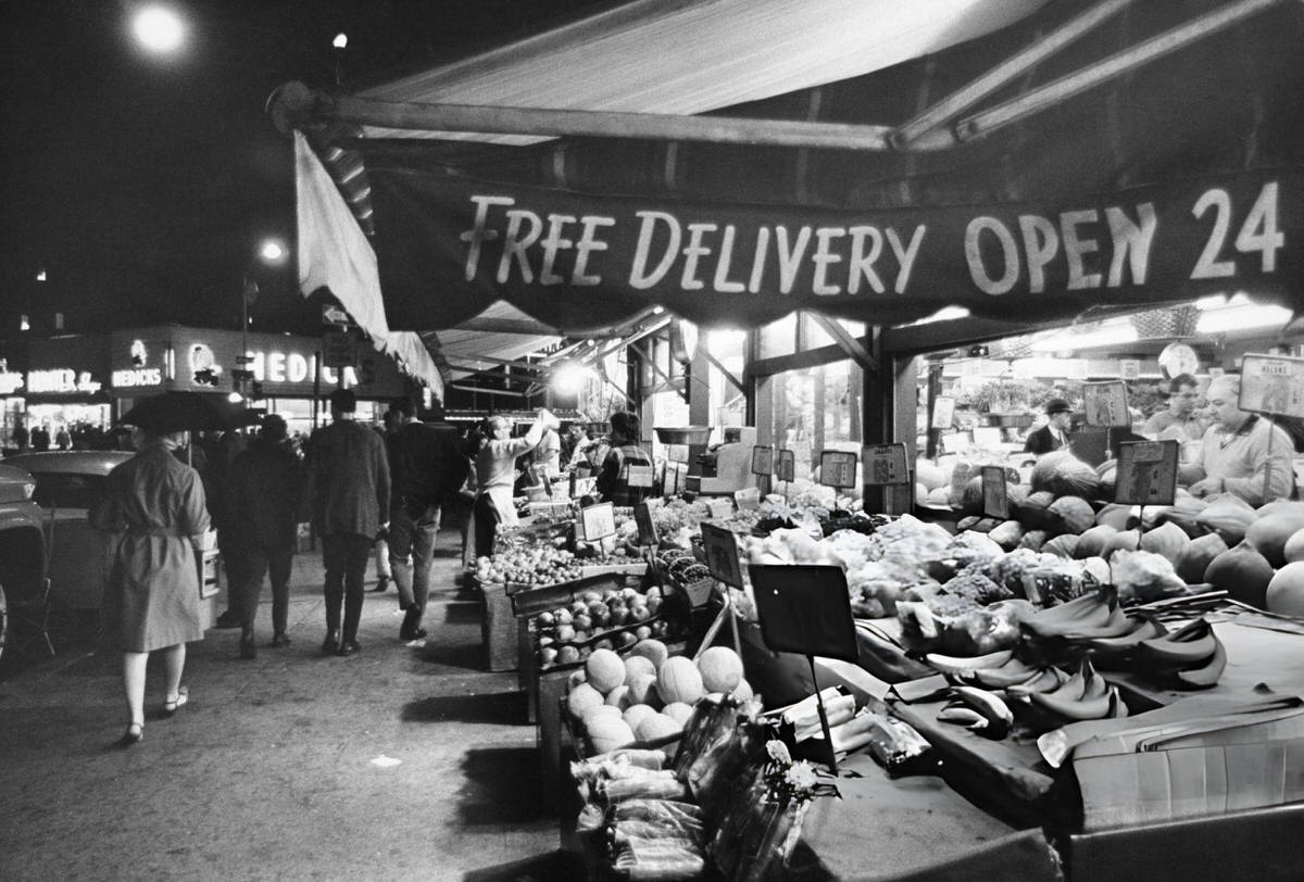Pedestrians Passing The Balducci'S Produce Stall In Greenwich Village, 1970.