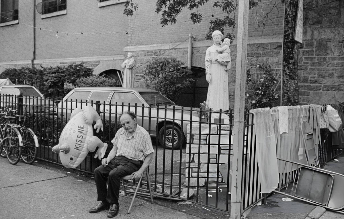 Man Sitting Outside St. Anthony Of Padua Church On Sullivan Street, 1979.