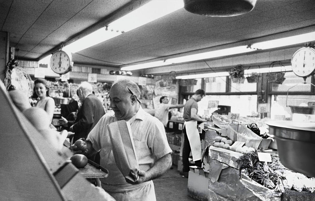 Greengrocer Bagging Tomatoes At Balducci'S In Greenwich Village, 1970.