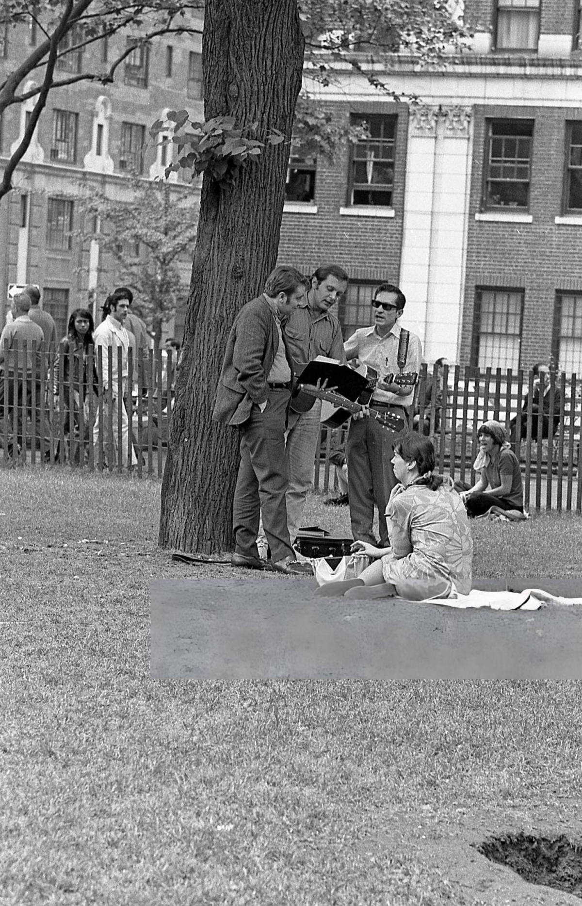 Musicians Performing For A Woman In Washington Square Park, 1970.