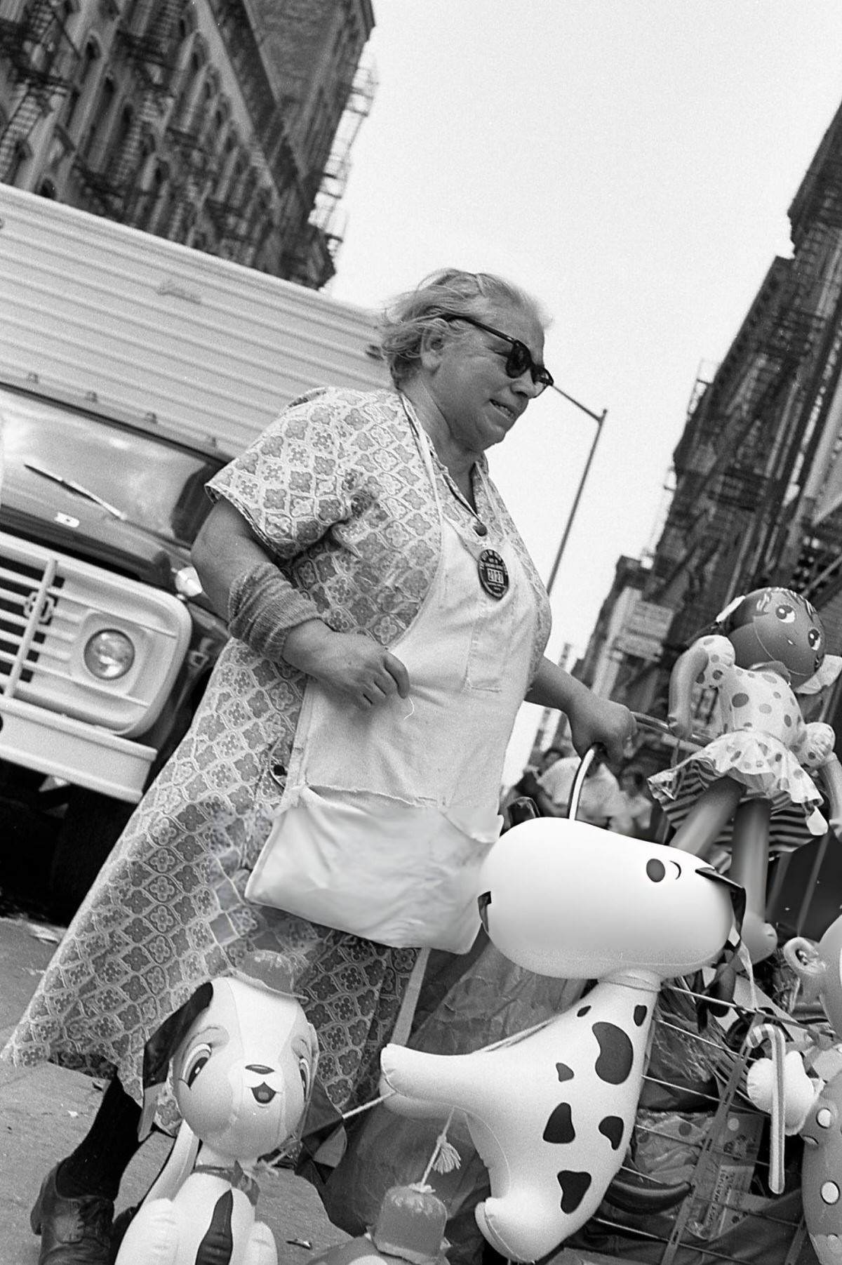 Sidewalk Vendor Selling Inflatable Toys In Greenwich Village, 1970.
