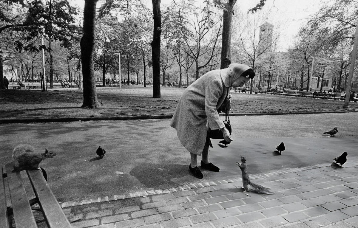 Woman Feeding A Squirrel In Washington Square Park, 1972.