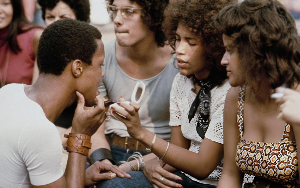 Young Person Using A Compact Mirror In Washington Square Park, Manhattan, 1970.