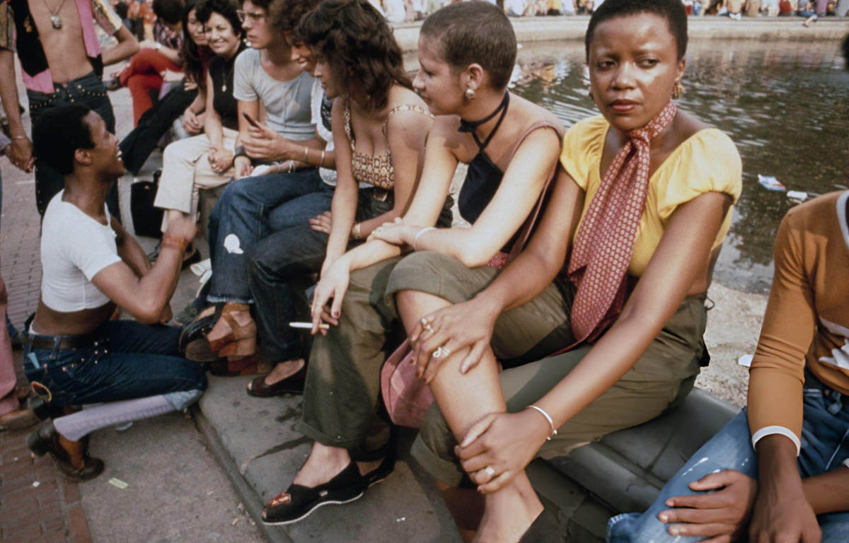 Group Of Young People Sitting By The Fountain In Washington Square Park, Manhattan, 1970.