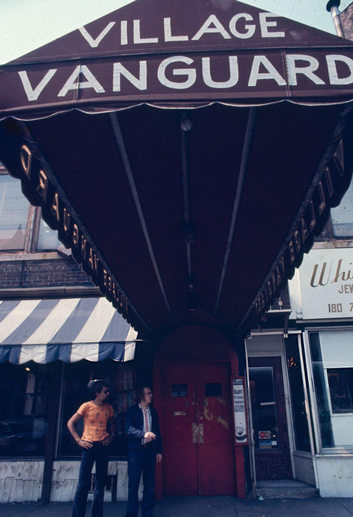 Mel Lewis Standing In Front Of The Village Vanguard, New York, 1970S.