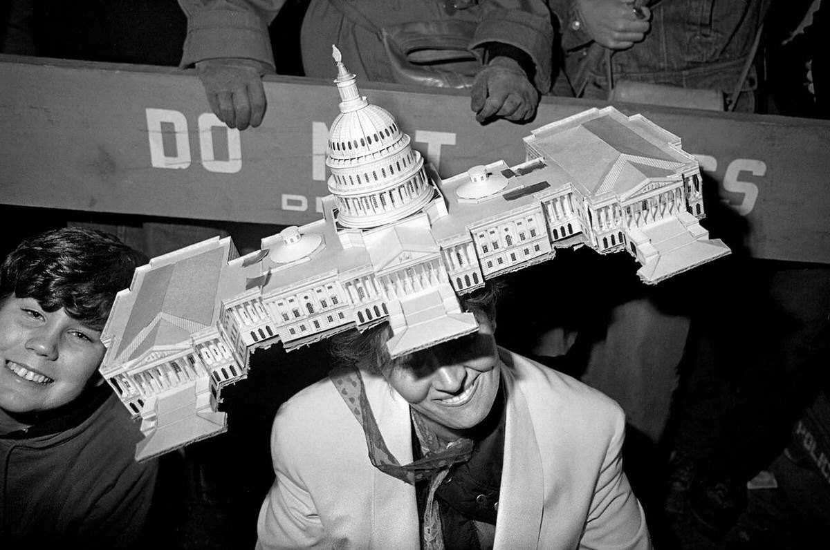 Woman With A Capitol Building Hat At The Village Halloween Parade, New York, 1983.