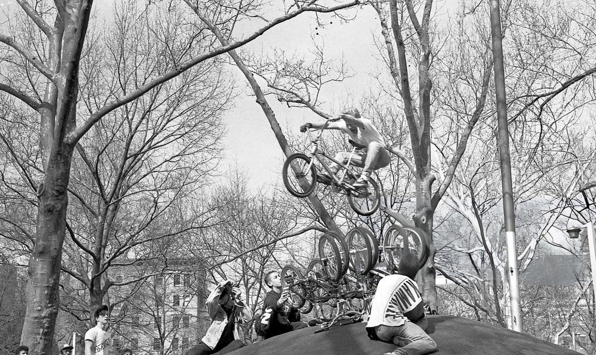 Cyclist Jumping Over A Row Of Bicycles In Washington Square Park, 1989.