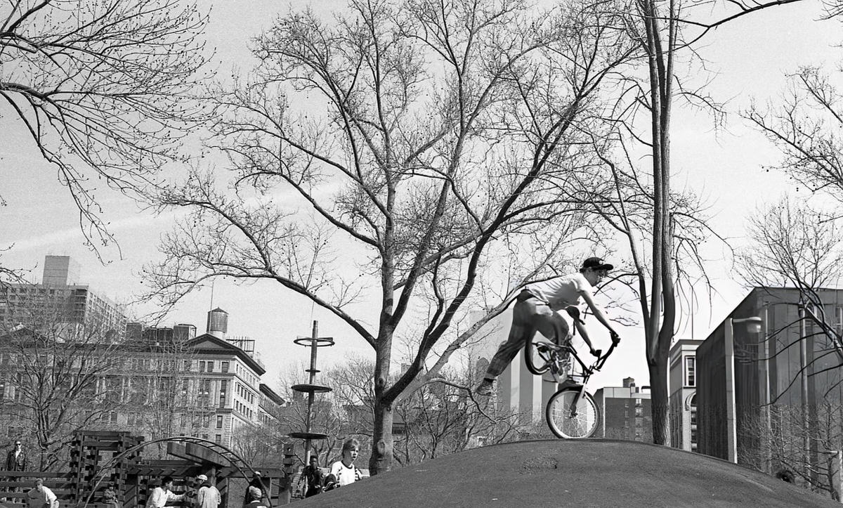 Cyclist Balancing On A Front Wheel In Washington Square Park, 1989.