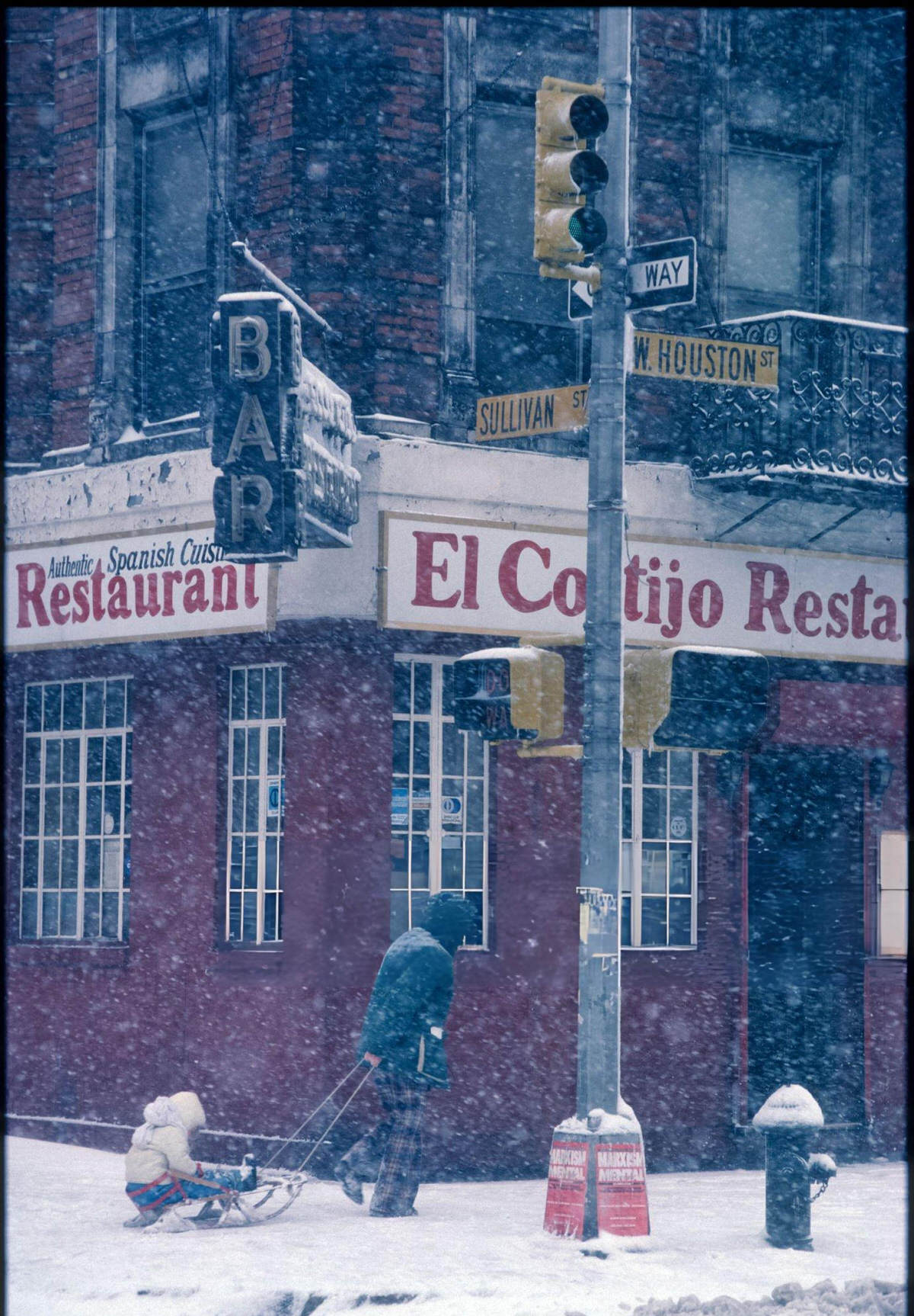 Adult Pulling A Child On A Sled At Sullivan And West Houston Streets, 1982.