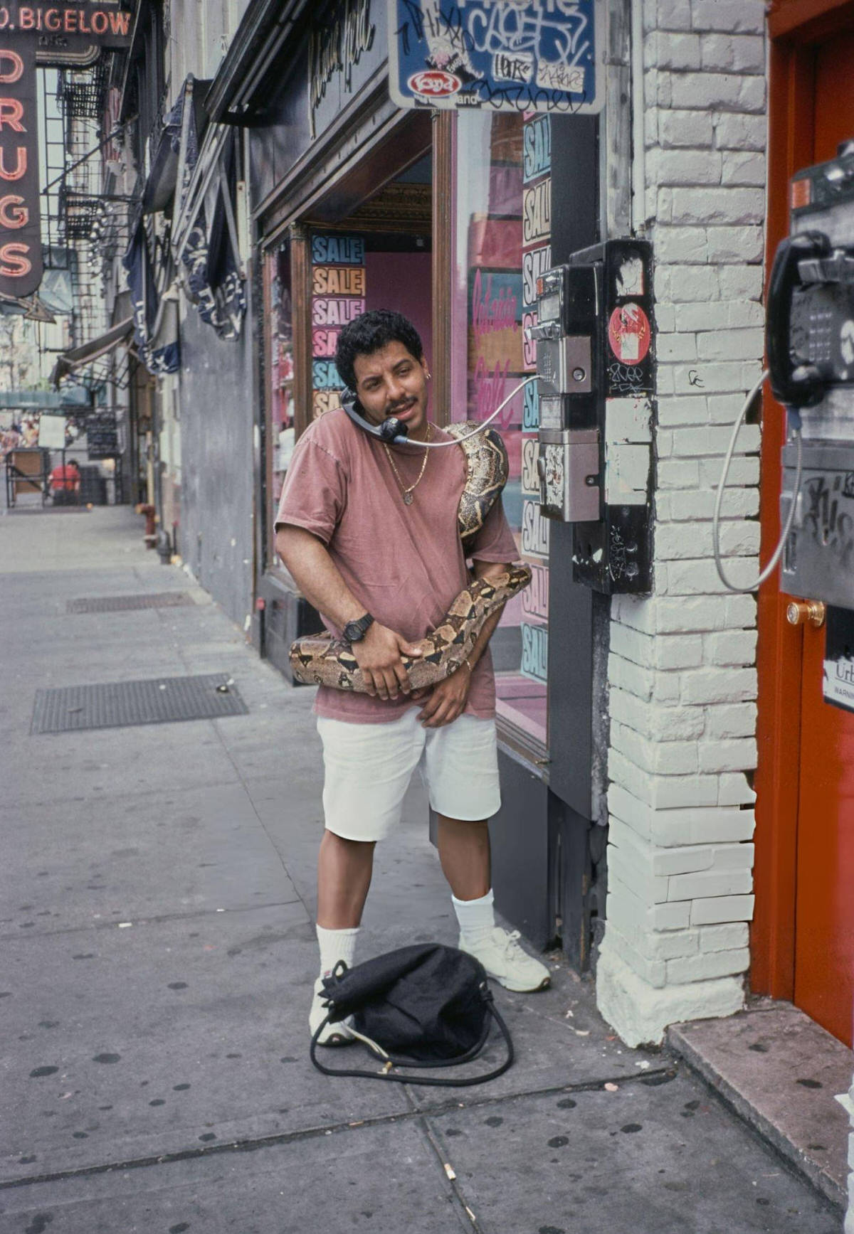 Man With A Snake Using A Pay Phone In Greenwich Village, 1993.