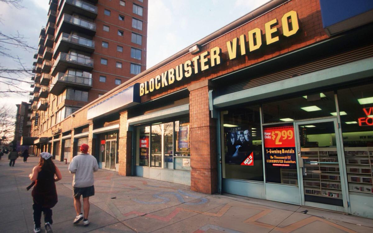 Pedestrians Passing A Blockbuster Video On Houston Street, East Village, 1998.