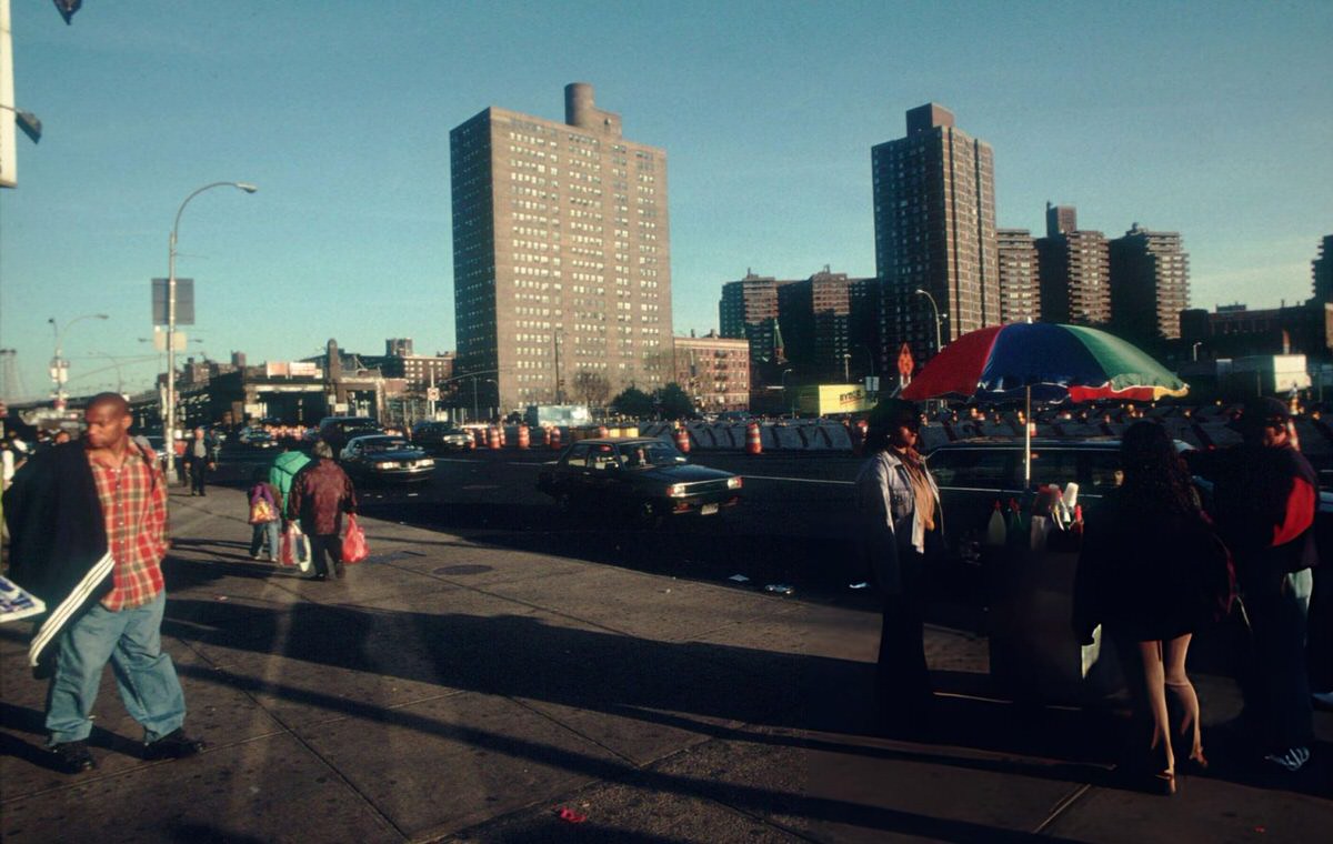 Pedestrians And Traffic Near Housing Projects On Delancey Street, East Village, 1998.
