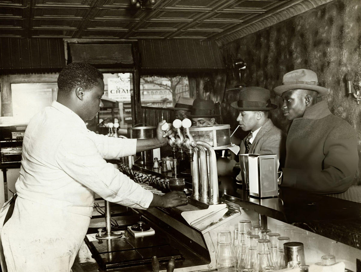 Barman Serving A Soda In A Racially Segregated Establishment, 1920.
