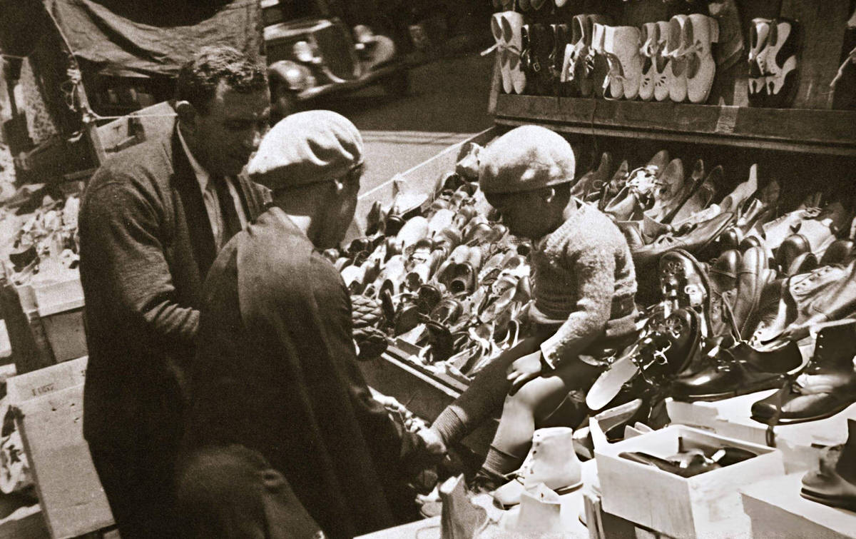Woman Buying Shoes For Her Child In Harlem, 1920S.