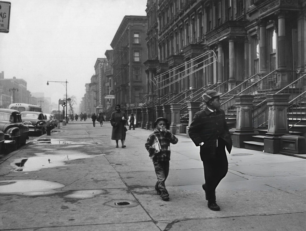 Two People Walking On Lenox Avenue, Harlem, 1956.