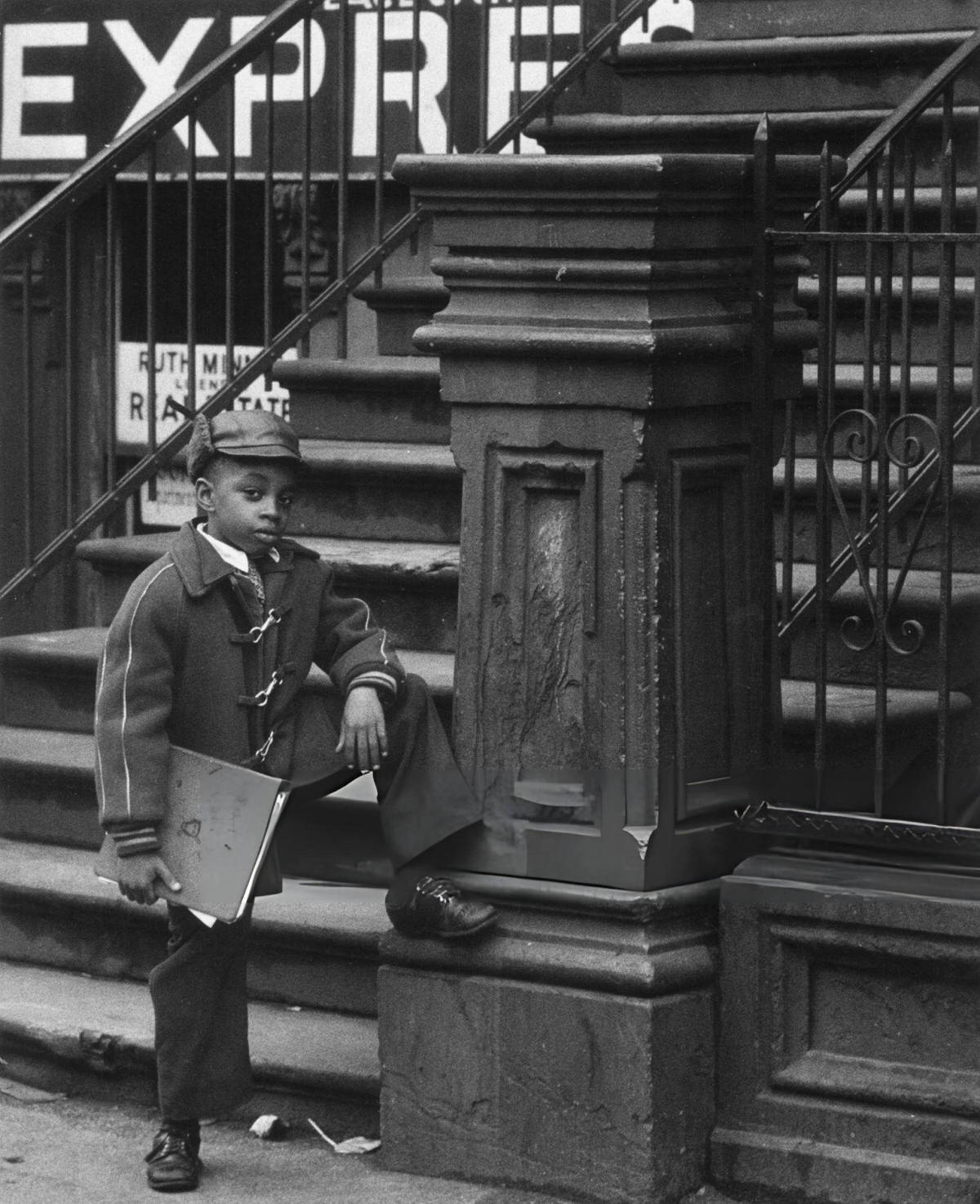 Child Posing In Front Of The Steps Of A Harlem House, 1956.
