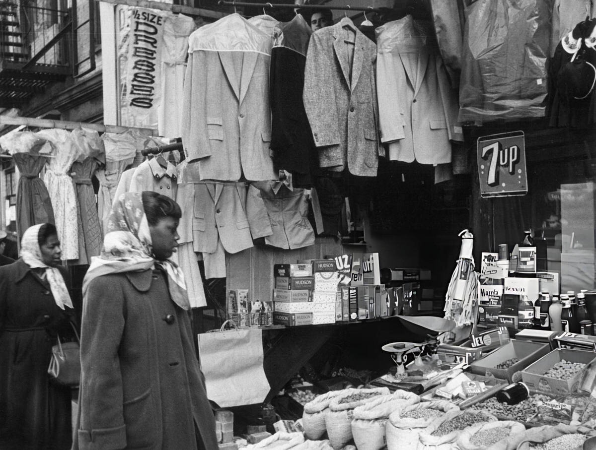 Customers Looking At Goods In A Shop Open To The Street, Harlem, 1956.