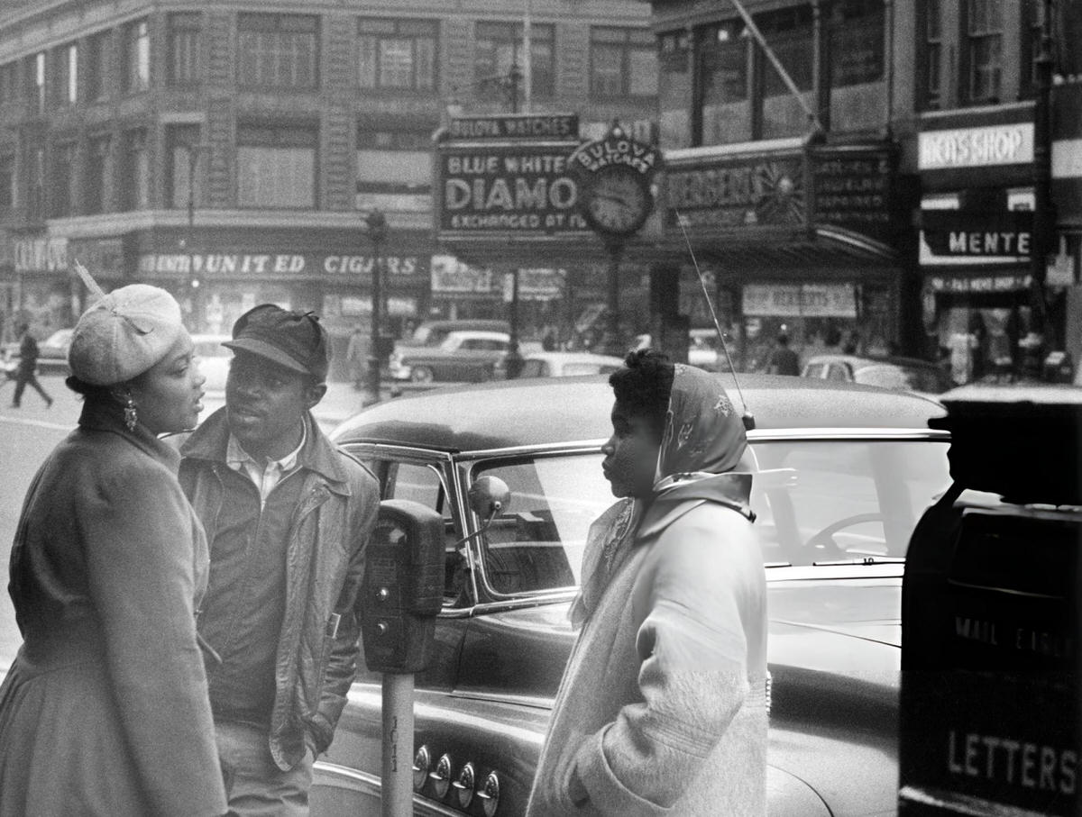Three People Talking On A Harlem Street, 1956.