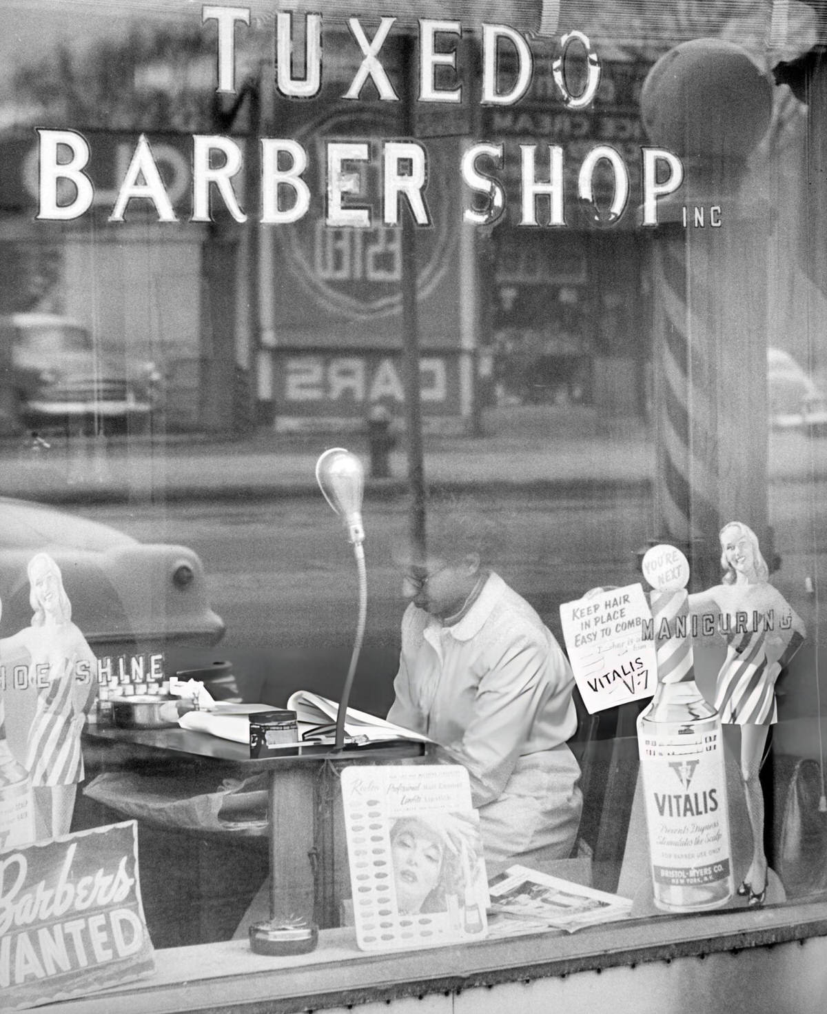 Woman Reading A Magazine In A Harlem Barber Shop, 1956.