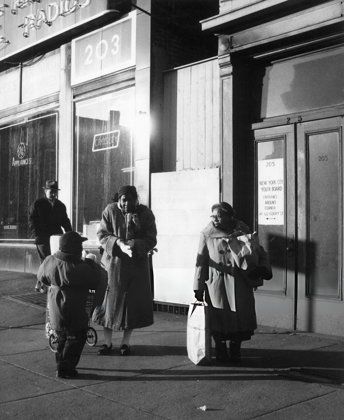 Residents Returning Home After Saturday Shopping, Harlem, 1956.