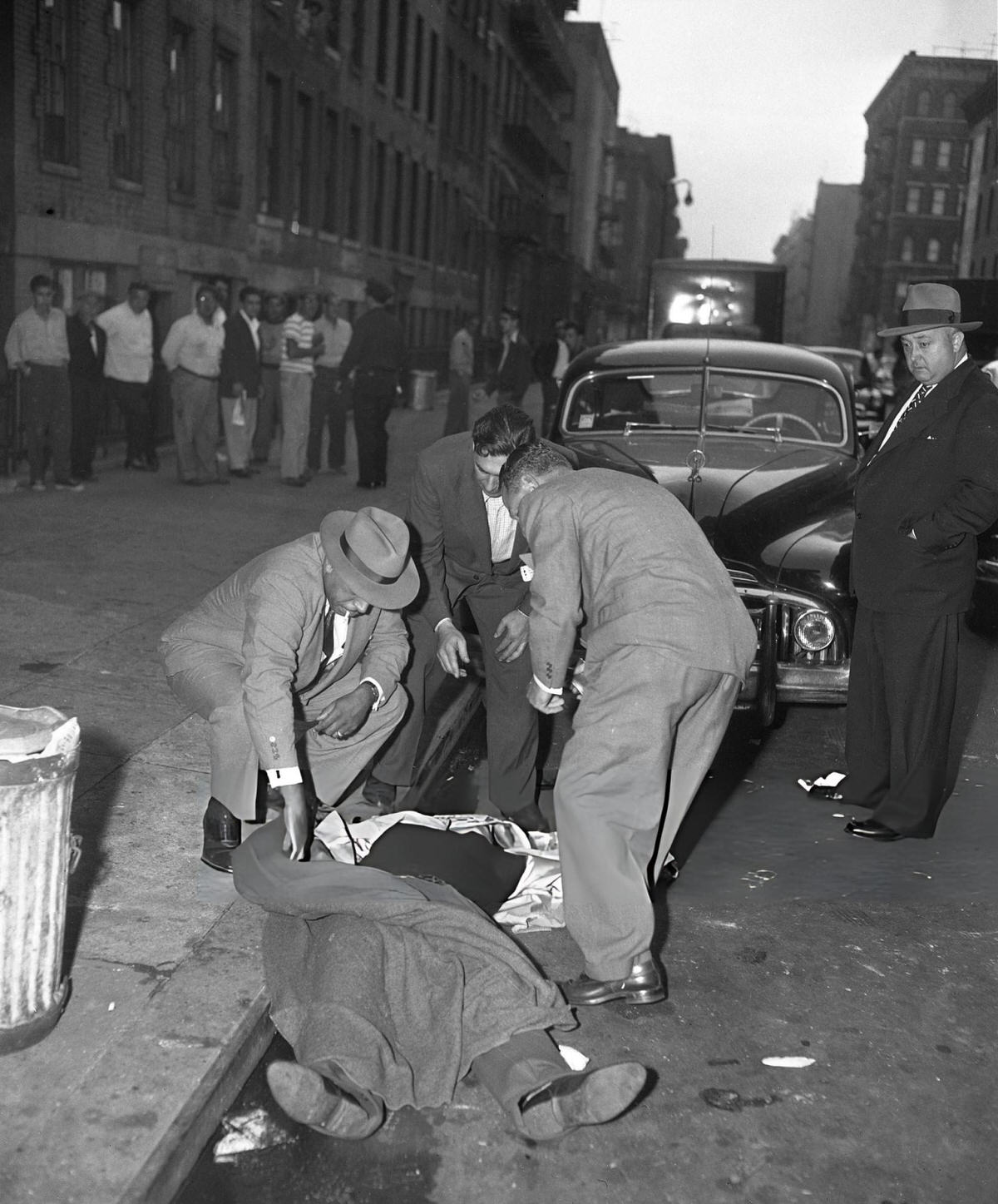 Detectives Examining The Body Of Eugene Giannini On East 107Th Street, Harlem, 1952.