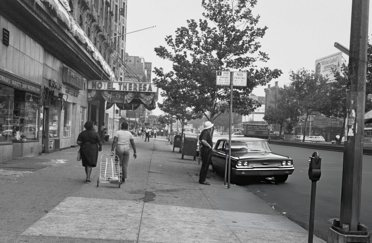 Pedestrians Outside The Hotel Theresa On Seventh Avenue, Harlem, 1964.