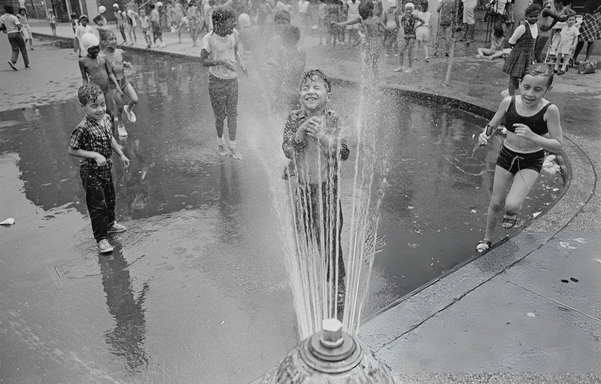 Children Cooling Off In The Spray From A Fire Hydrant, Harlem, 1966.