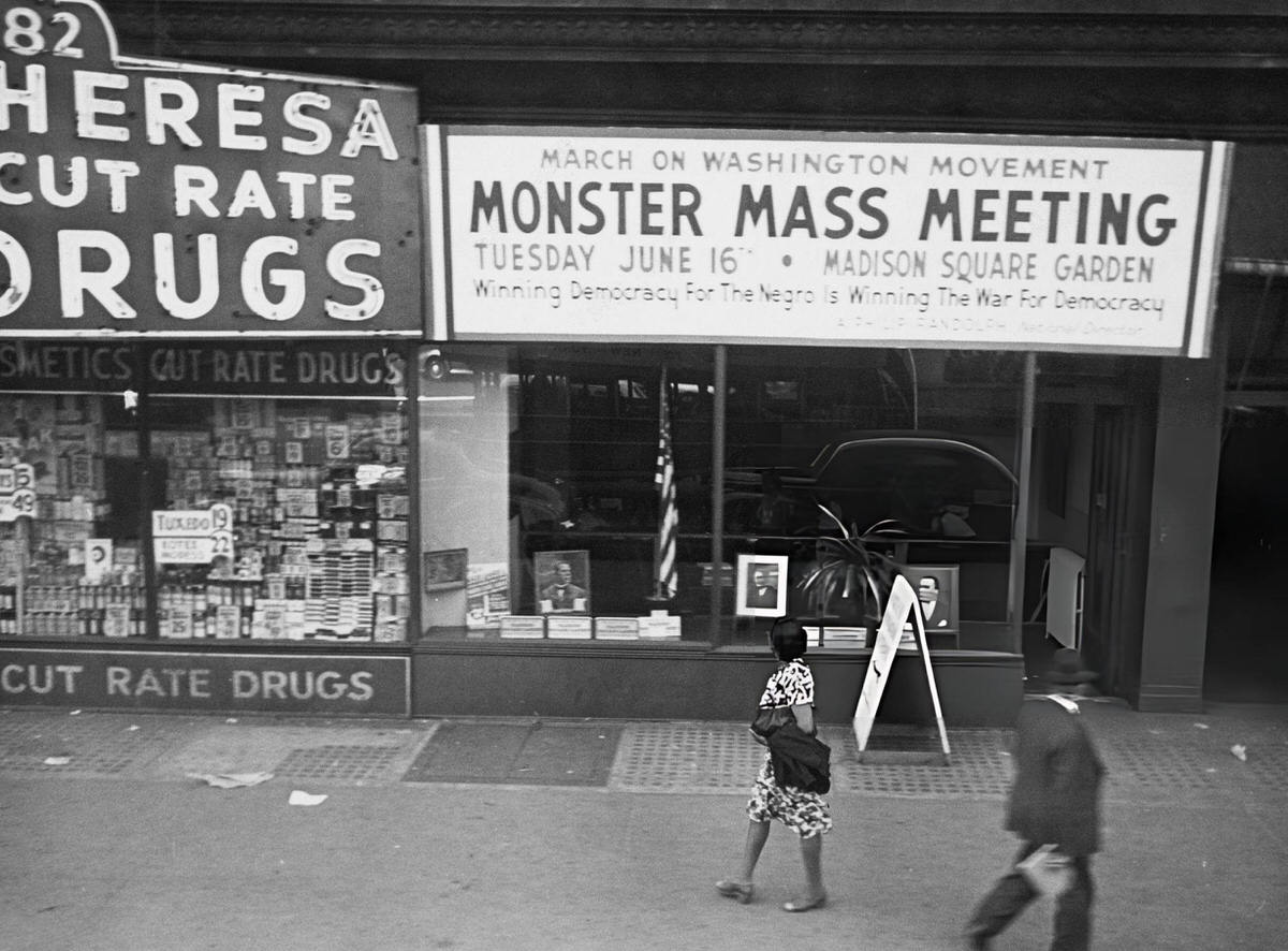 Pedestrians Passing A Sign For The March On Washington Movement Mass Meeting, Harlem, 1963.