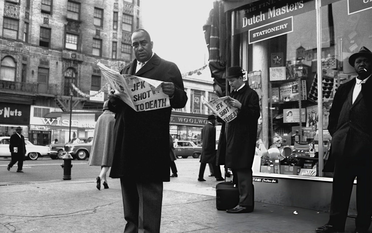 Man Reading A Newspaper Reporting The Assassination Of John F. Kennedy On A Harlem Street Corner, 1963.