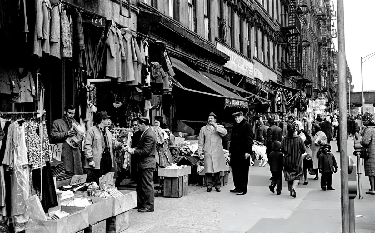 People Browsing Clothes For Sale Outside A Shop, Harlem, 1963.