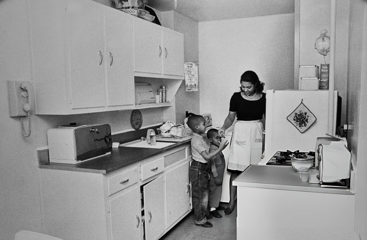 Mrs. Leroy Adolph With Her Sons In The Kitchen Of Their Drew-Hamilton Home, Harlem, 1965.