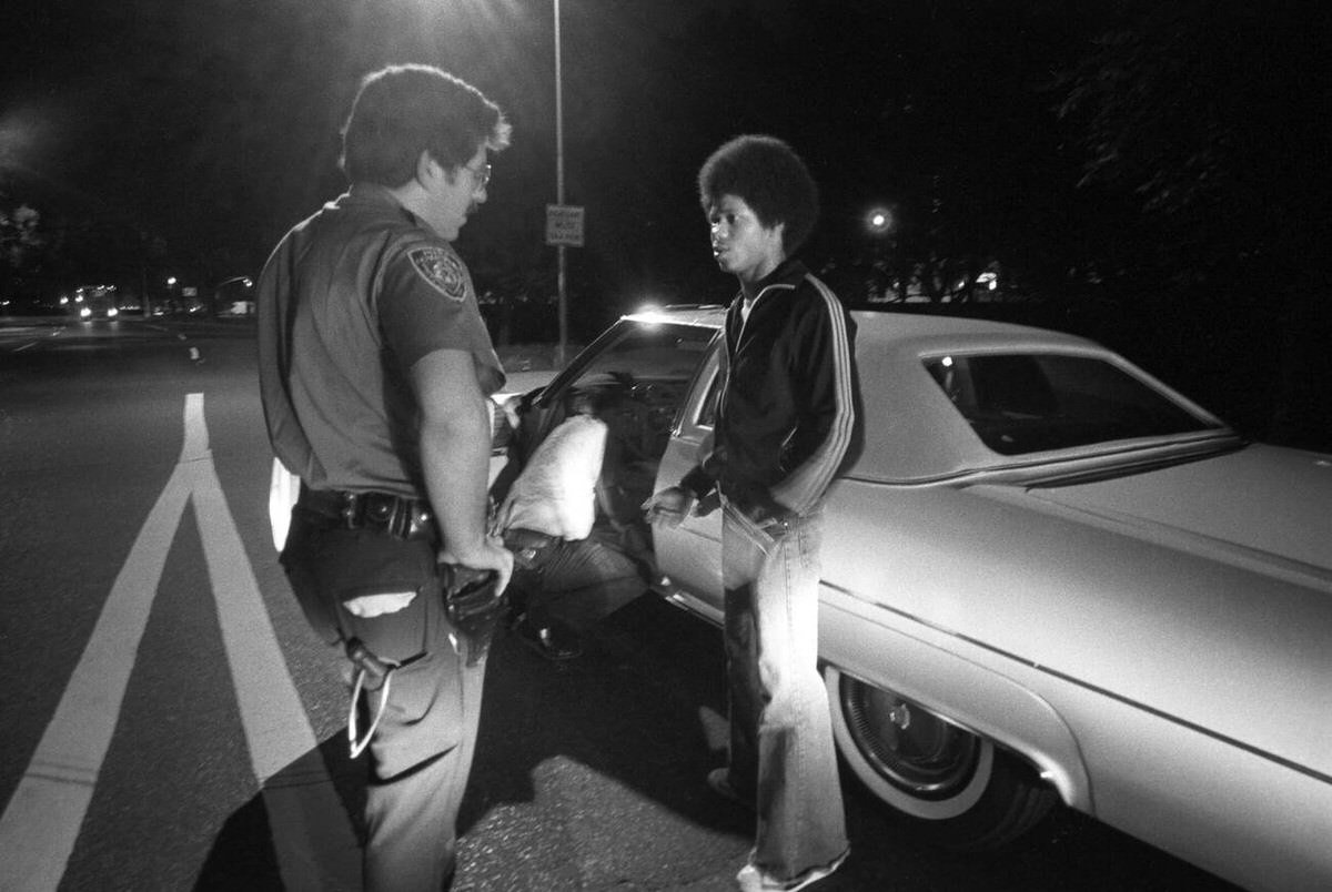 Police Officers From The 28Th Precinct Searching A Young Man, Harlem, 1978.