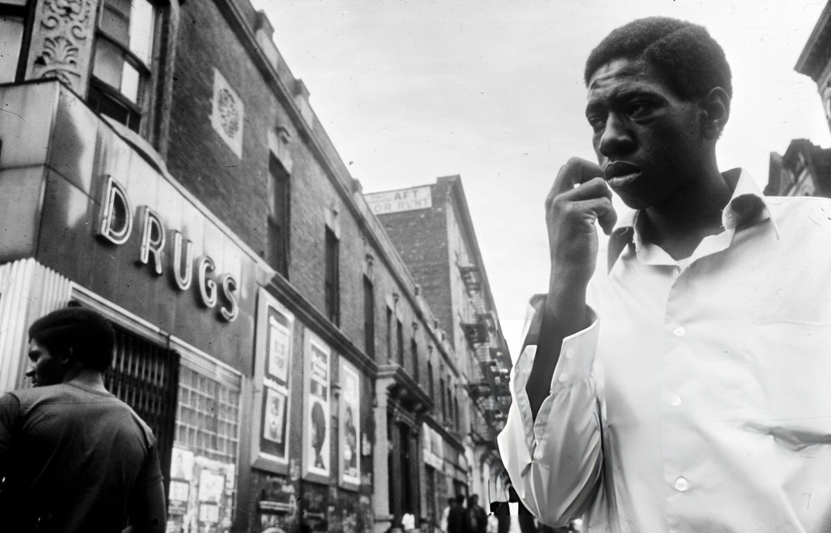 Man Walking Past A Shop With A &Amp;Quot;Drugs&Amp;Quot; Sign, Harlem, 1970.