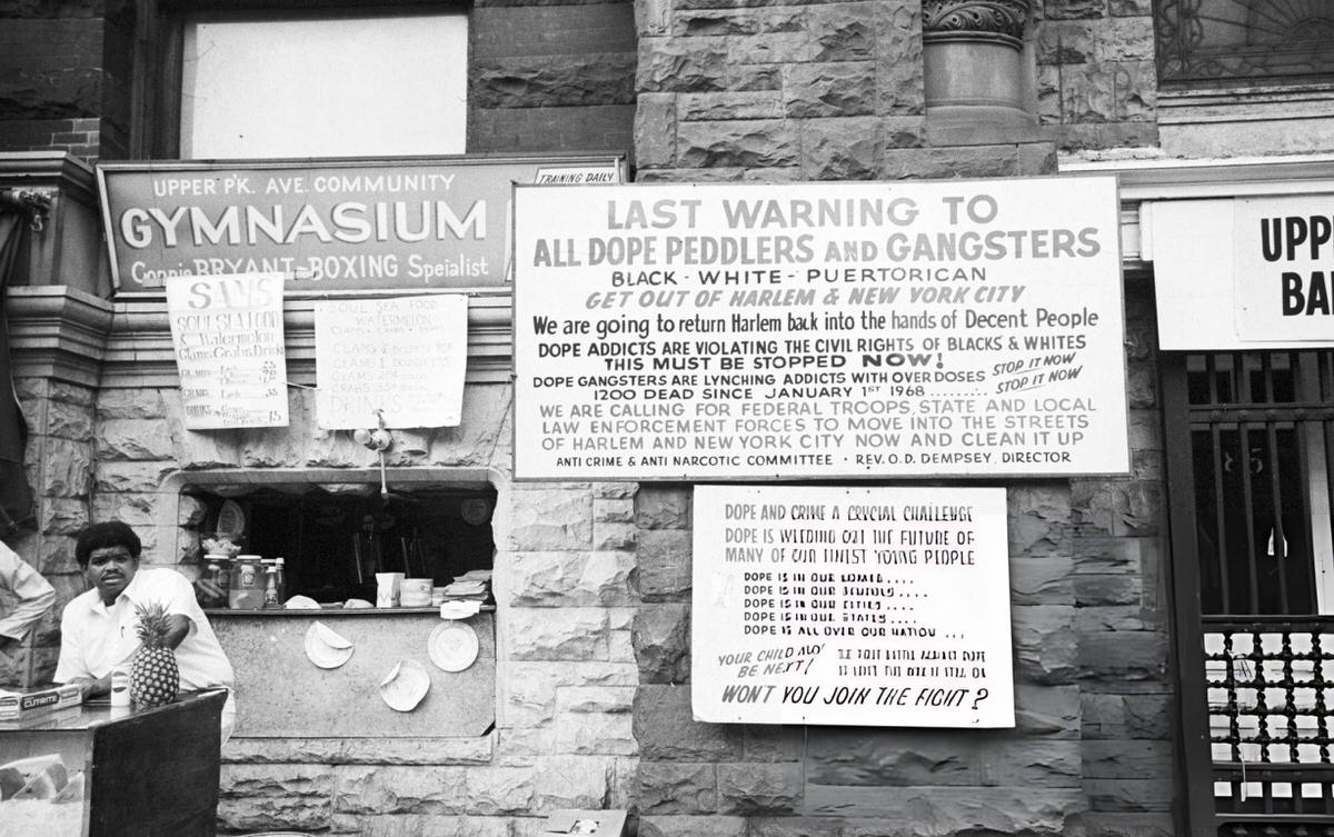 Mobile Counter In Front Of A Shop With A Sign Discouraging Gangsters, Harlem, 1970.