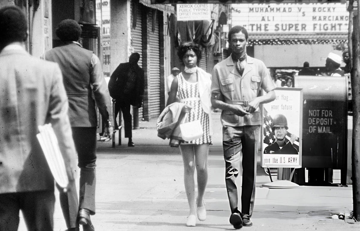 Couple Walking Past U.s. Army Recruitment Posters, Harlem, 1970.