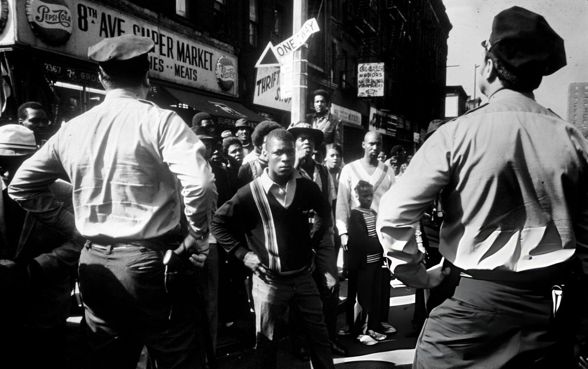 Residents And Police Officers Gathered In Front Of A Shop, Harlem, 1970.