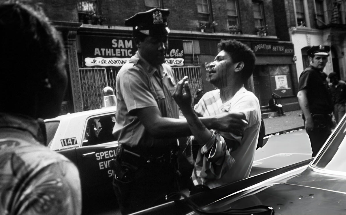 Police Officer Arresting An Injured Man On A Harlem Street, 1970.