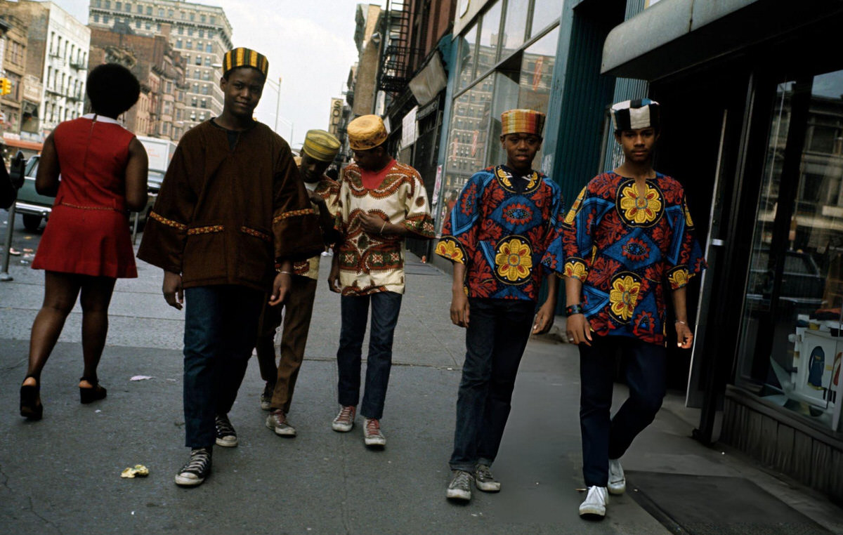 Group Of Boys In Multicoloured Tunics Walking In Harlem, 1970.