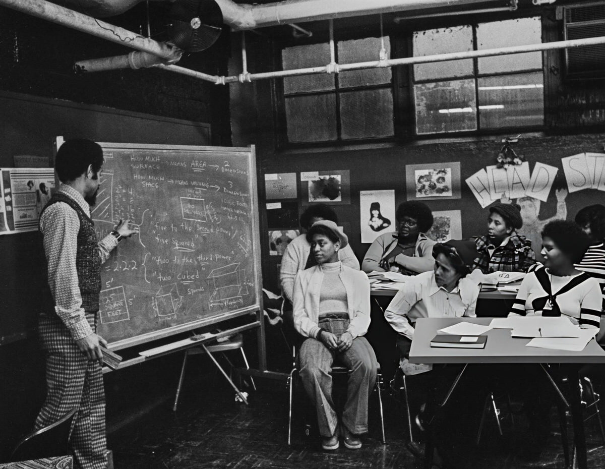 Teacher Explaining Geometry To Adult Students In East Harlem, 1975.